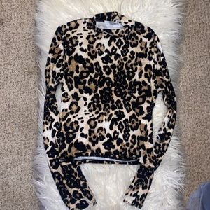 Cute long sleeved leopard print top, never worn.